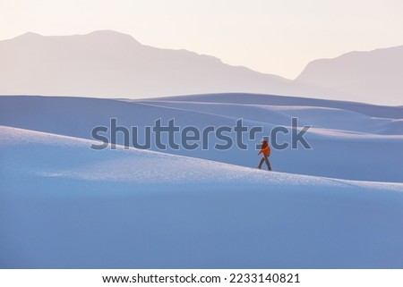 Hiker in White Sands Dunes in New Mexico, USA Royalty-Free Stock Photo #2233140821