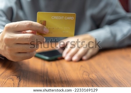 businessman using credit card and laptop to login to internet bank.Online shopping, e-commerce, internet banking, and financial transactions payments via e-bank application concept.