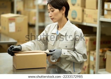 Japanese woman working in a warehouse