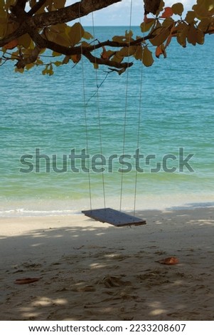 infrared image of the single rope bench swing by the beach.