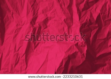Crumpled paper Viva Magenta color of the year 2023. Texture crumpled paper for your design. Copy space. Viva Magenta color paper. Royalty-Free Stock Photo #2233210631