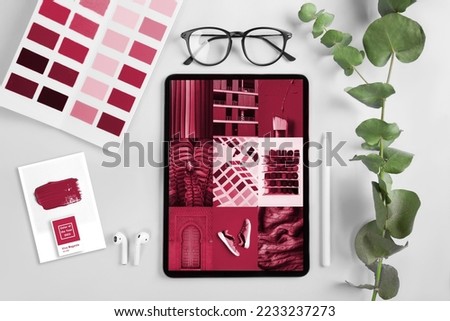 Workplace with tablet , coffee pencil. New 2023 trending PANTONE 18-1750 Viva Magenta color