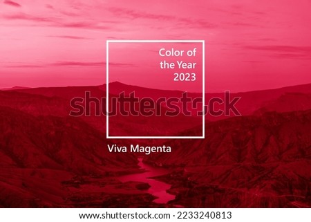 Winding turquoise Sulak River in crevice in mountains of Dagestan at summer sunset. Image toned in trendy pantone color of year 2023 Viva Magenta. Royalty-Free Stock Photo #2233240813