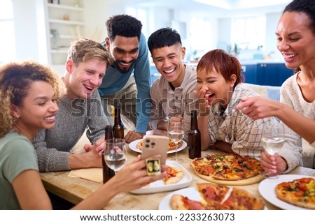 Friends Taking Selfie On Phone Having Fun At Home In Kitchen Eating Homemade Pizzas