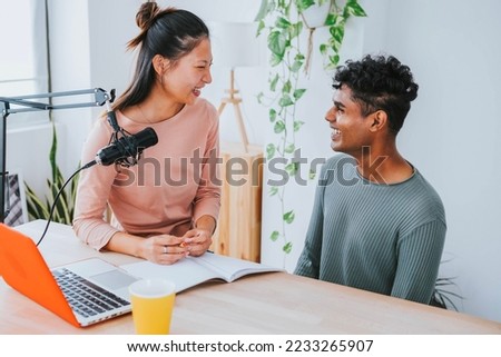 Female radio presenter interviewing guest in podcast radio station - Broadcast live radio concept