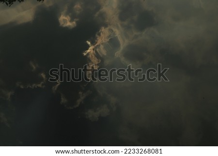 Rays of light shining through dark clouds for background