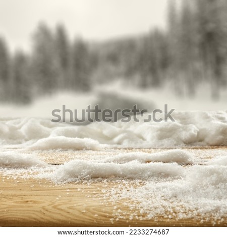 Desk of free space cover of snow and winter landscape of mountains. 