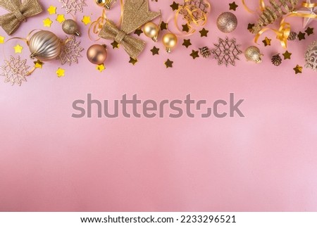 Rose gold Christmas, New Year background with golden bauble, holiday decoration, Christmas tree balls, flat lay on pink background copy space