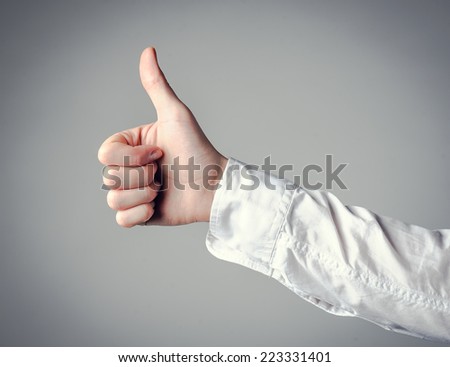male hand gesturing the ok sign