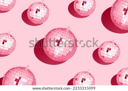 Color of the year 2023 viva magenta.
Shiny disco balls. Creative Christmas pattern. 90s retro party time concept. Xmas holiday background. Top view. Flat lay.  Royalty-Free Stock Photo #2233315099