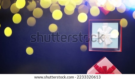 Christmas decoration. Gift boxes on black stone  background. Top view. Christmas greeting card concept.
