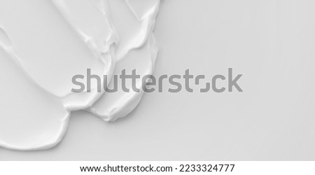 Skin cream white background beauty texture. Skincare moisturizer lotion smear cosmetic horizontal banner format with copy space Royalty-Free Stock Photo #2233324777