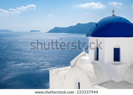 GREECE, SANTORINI- OCT 3: The greek church in the Oia village, sea view. October 3, 2014