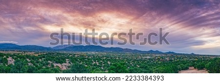 Sun Breaking through the Clouds Over Sangre de Cristo Mountains and Santa Fe New Mexico 