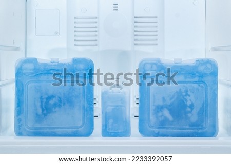 Blue ice packs in refrigerator freezer Royalty-Free Stock Photo #2233392057