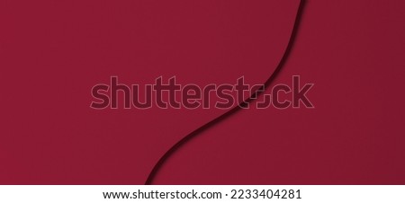 Abstract colored paper texture background. Minimal paper cut style composition with layers of geometric shapes and lines in viva magenta colors. Top view