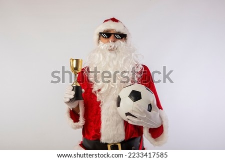 santa claus with sunglasses "thug life" soccer ball and a trophy in his hand on white background