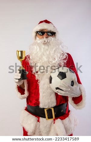 santa claus with sunglasses "thug life" soccer ball and a trophy in his hand on white background