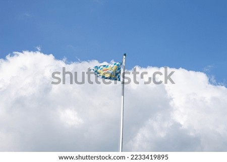 Bavarian flag in front of an White and blue sky