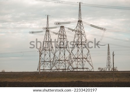 High-voltage wires against the backdrop of cold weather in Ukraine. Energy and electricity. The threat of de-energized cities. Energy supply of the country. electricity generation Royalty-Free Stock Photo #2233420197