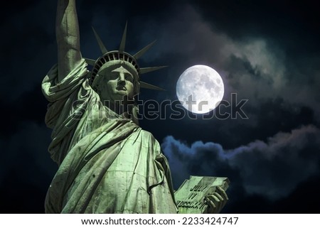 Statue of liberty on full moon sky background