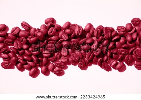 Isolated magentaroasted coffee beans in harsh light. White background, top view. For banners and trimming web pages