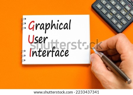 GUI graphical user interface symbol. Concept words GUI graphical user interface on white note on a beautiful orange background. Business and GUI graphical user interface concept. Copy space.