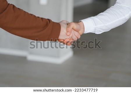 Close-up image of a firm handshake standing for a trusted partnership.
