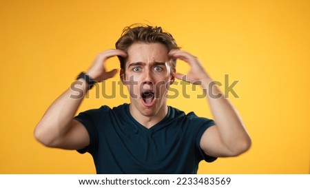 Handsome thinking young man 20s, looks at camera gives mind blown gesture showing explosion of ideas posing on green screen background. Royalty-Free Stock Photo #2233483569