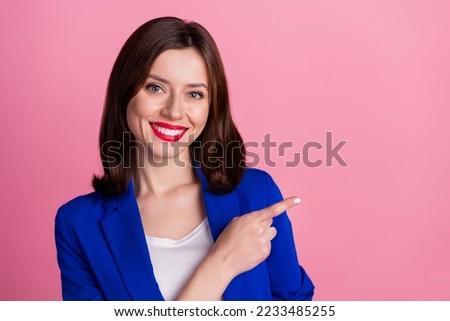 Closeup photo of young cheerful entrepreneur business company owner finger point empty space recommend new offer isolated on pink color background