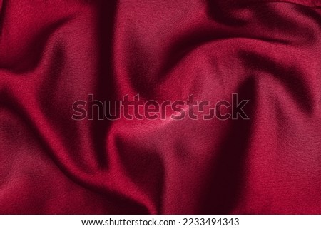 Pantone 2023 color Viva magenta. fabric laid in soft folds