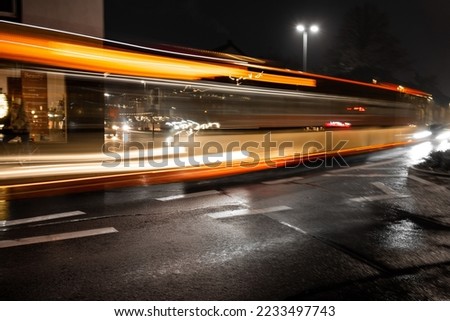 bus long shutter time at night  Royalty-Free Stock Photo #2233497743