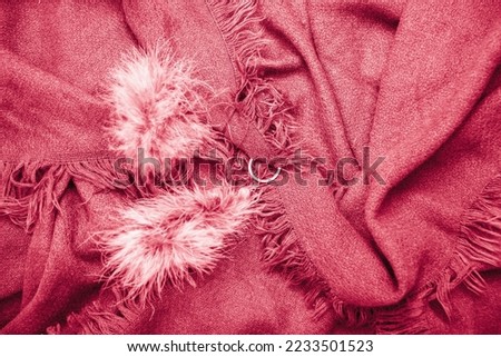 bright magenta scarf with fringe,natural background,fashion accessory for autumn
