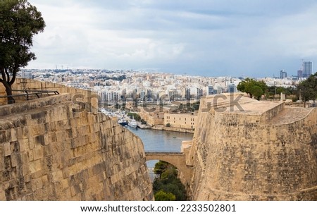 Valletta, 16th century massive fortification from the Hastings Garden Malta with a view on Manoel island and Gzira Royalty-Free Stock Photo #2233502801