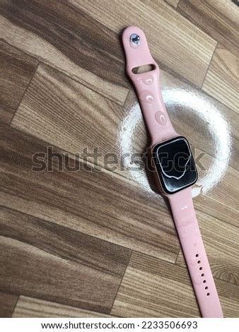 digital watch or smartwatch or pink bracelet