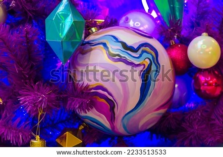 purple christmas tree with christmas decorations
