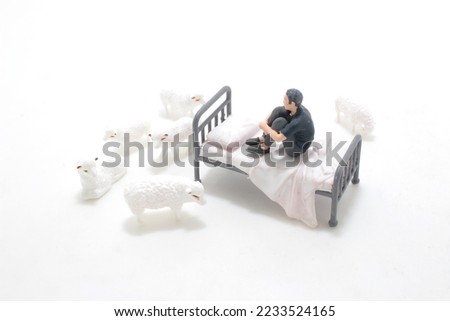 the mini figure, the Sleepless counting sheep Royalty-Free Stock Photo #2233524165