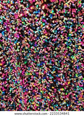 Colorful shiny sequin fabric texture, pink, yellow, blue, fun fashion bg background