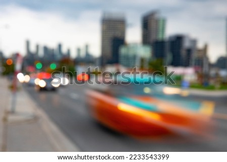 Blurry photo of cars going by at night