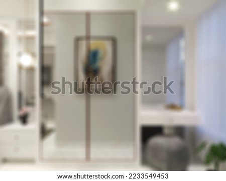 Defocused and Blur Photo of Excellent and Modern Walk In Closet Interior Design