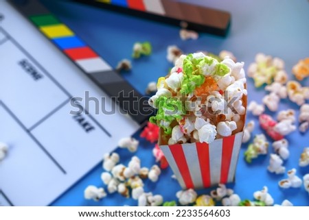 Movie clapper board and popcorn