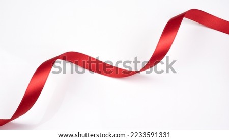 Abstract shape red ribbon isolated on white background.