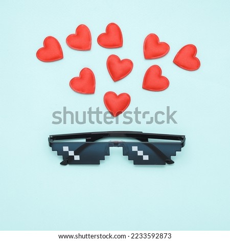 Pixelated 8 bit sunglasses with hearts on pastel background. Love concept