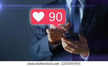 A businessman's hand operating a smartphone