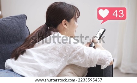 Young woman operating a smartphone