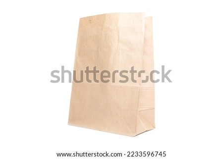 Paper bag for groceries on a white background. Eco package Royalty-Free Stock Photo #2233596745