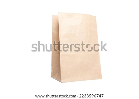 Paper bag for groceries on a white background. Eco package Royalty-Free Stock Photo #2233596747