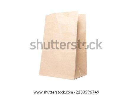 Paper bag for groceries on a white background. Eco package Royalty-Free Stock Photo #2233596749