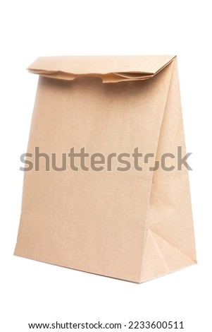 Paper bag for groceries on a white background. Eco package Royalty-Free Stock Photo #2233600511