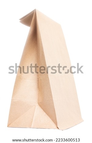 Paper bag for groceries on a white background. Eco package Royalty-Free Stock Photo #2233600513